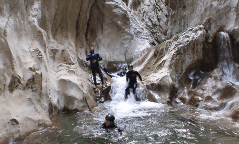 Men exploring nevidio canyon Montenegro Astra Real Estate Montenegro