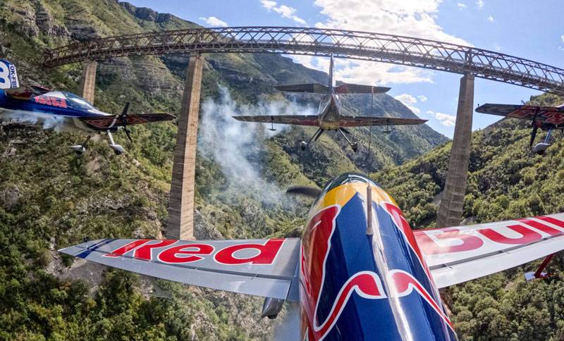 Red Bull pilots flying under the highest railway bridge in Europe in Mala Rijeka in Montenegro