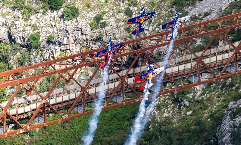 Red Bull pilots flying under the highest railway bridge in Europe in Mala Rijeka in Montenegro